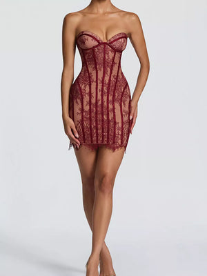 Burgundy lace overlay strapless mini dress with corset detail and scalloped hem.