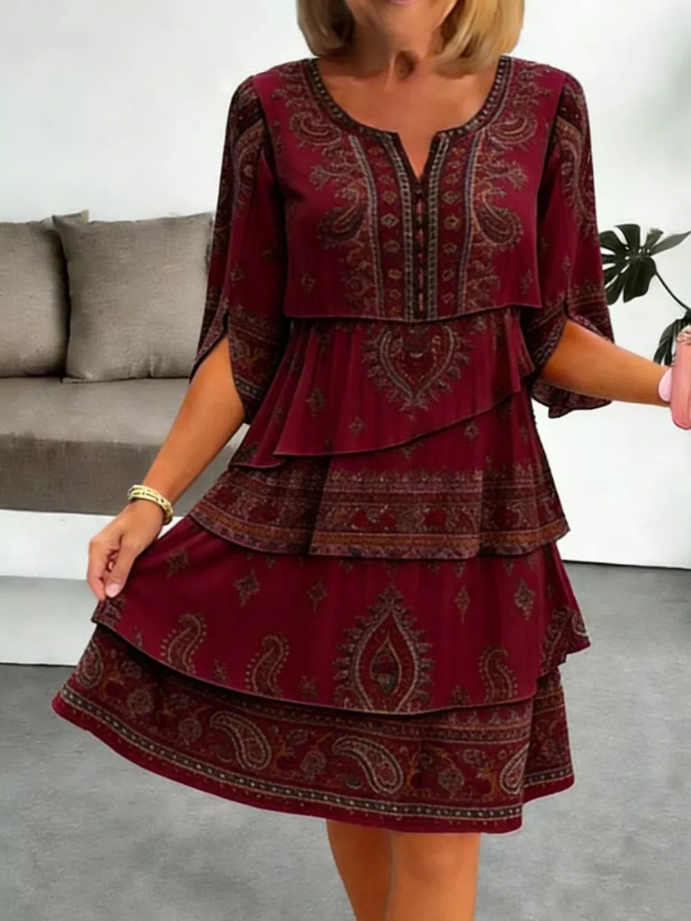 Burgundy paisley print tiered mini dress with split sleeves and V-neck.