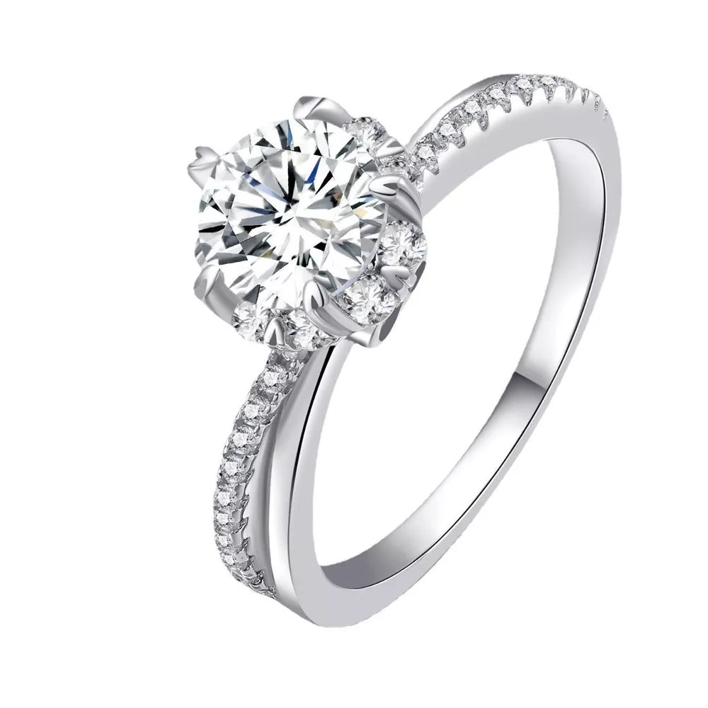 Brilliant moissanite ring in sterling silver with pavé band.