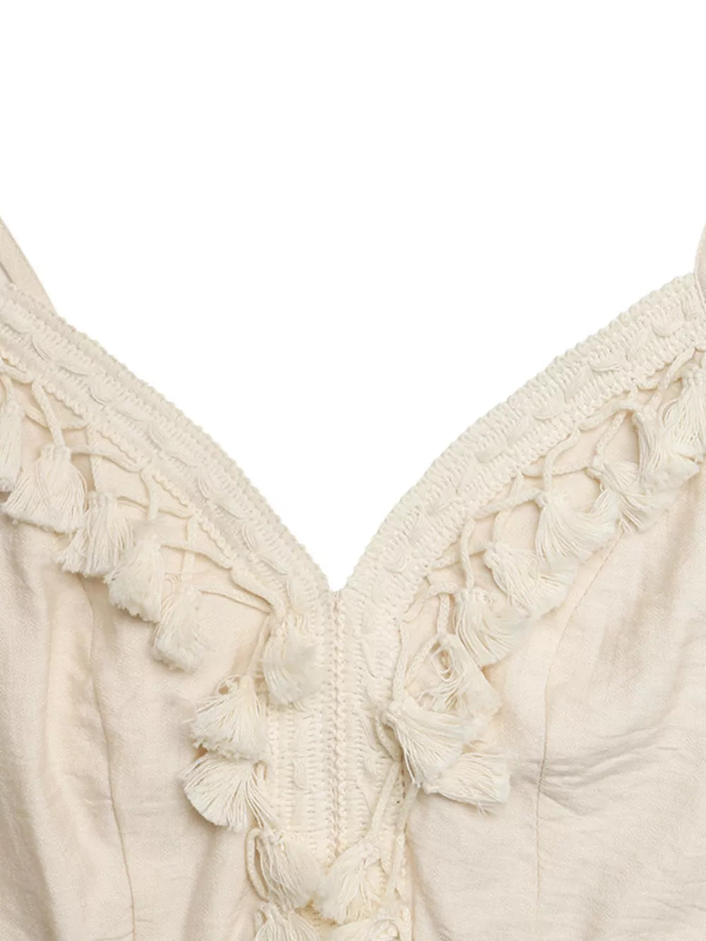 Cream lace-trimmed spaghetti strap romper with tassel details at V-neck.