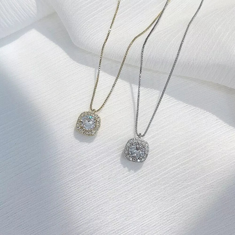 Elegant zircon pendant necklace in sterling silver, gold and silver box chains.