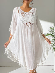 White crochet yoke tassel kaftan dress with a relaxed fit and boho style.