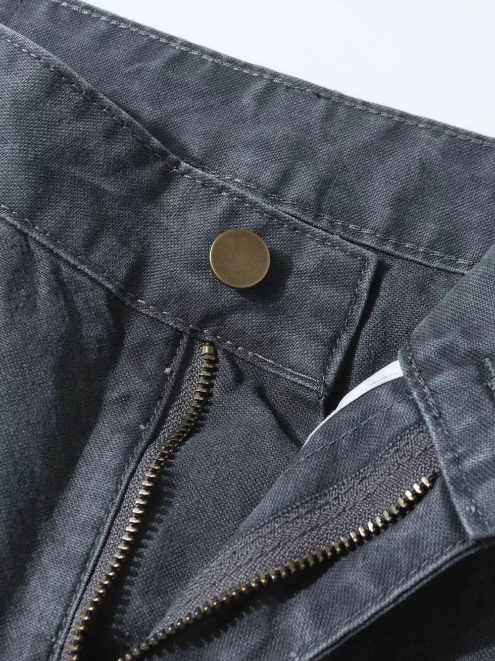Grey sweatpants with ink-splash detail, button and zipper closure