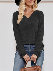 Textured ribbed V-neck pullover sweater in black with long sleeves.