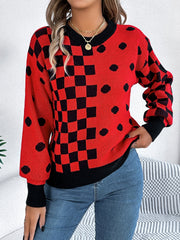 Red checkerboard & dot intarsia knit sweater with crewneck and black cuffs.