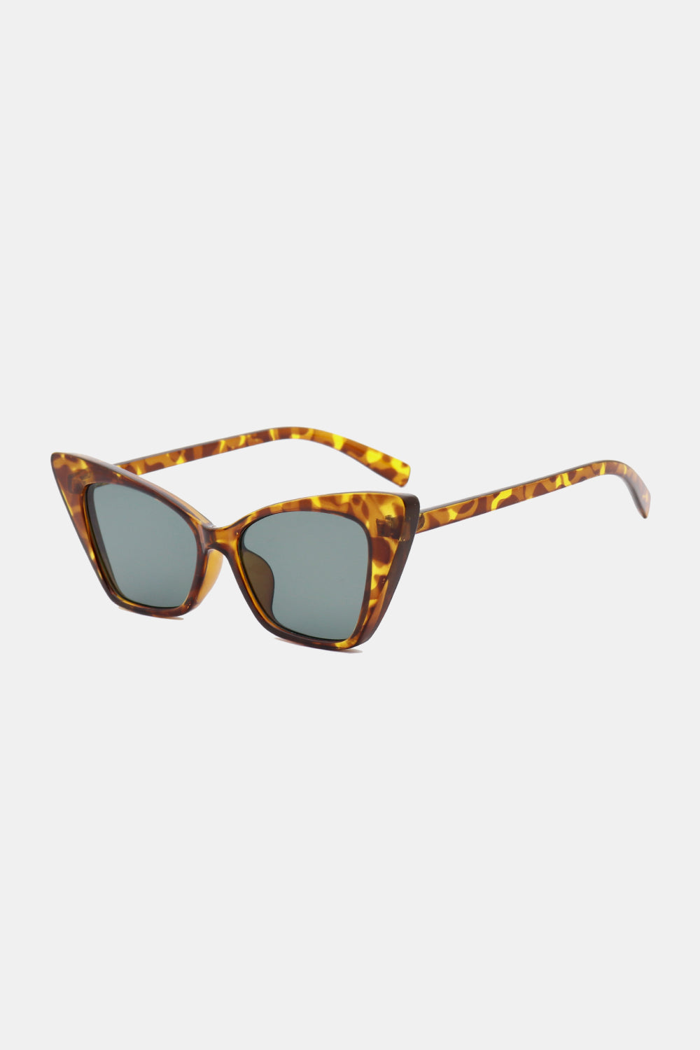 Sharp angular cat-eye sunglasses in tortoise shell acetate with grey lenses.