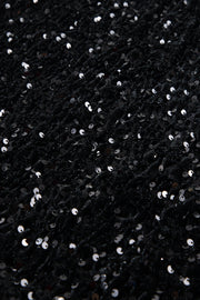 Black sequin mini skirt with body-hugging fit and textured fabric.