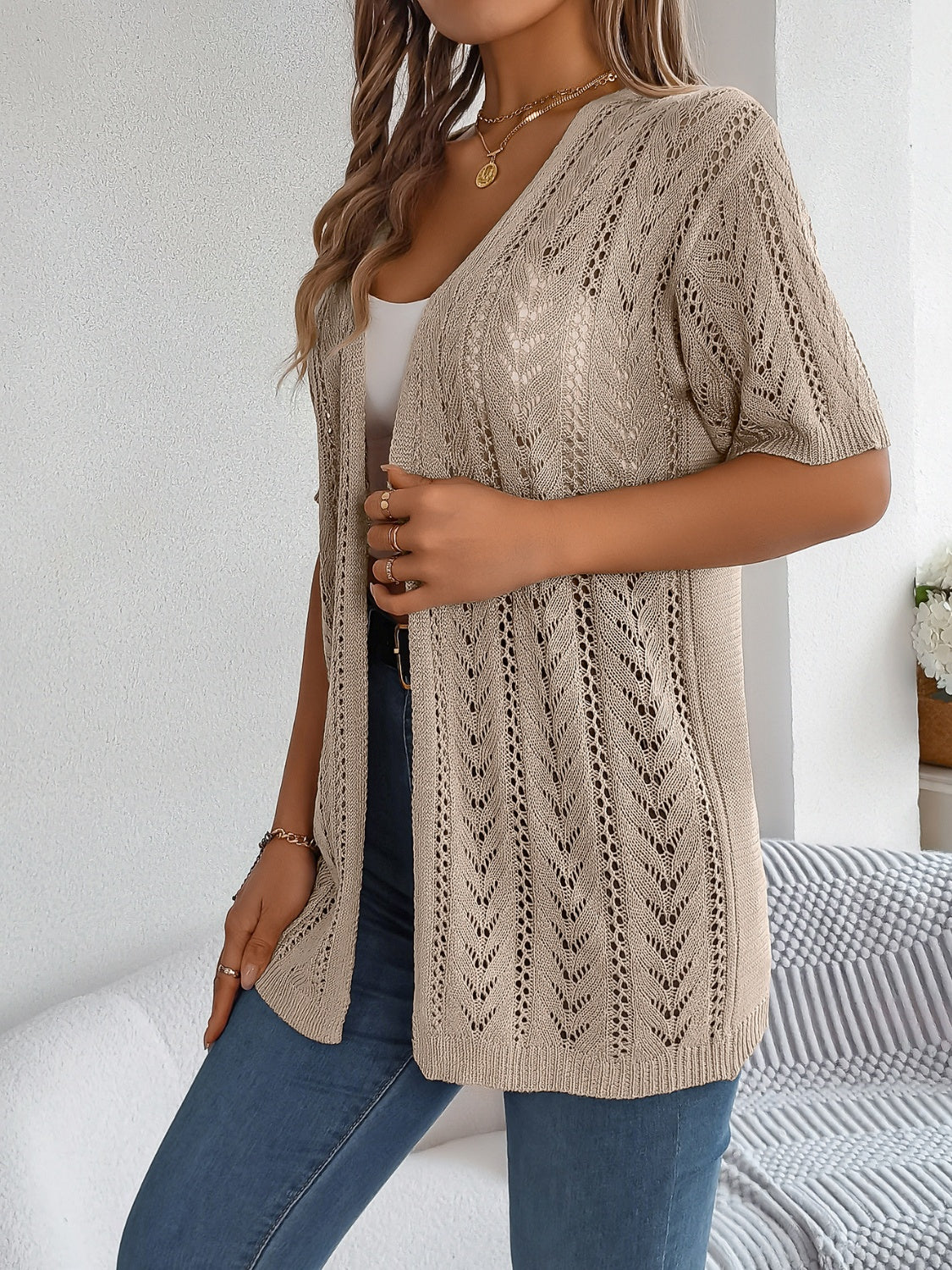 Open-knit chevron sleeve cardigan in tan acrylic with a V-neckline.