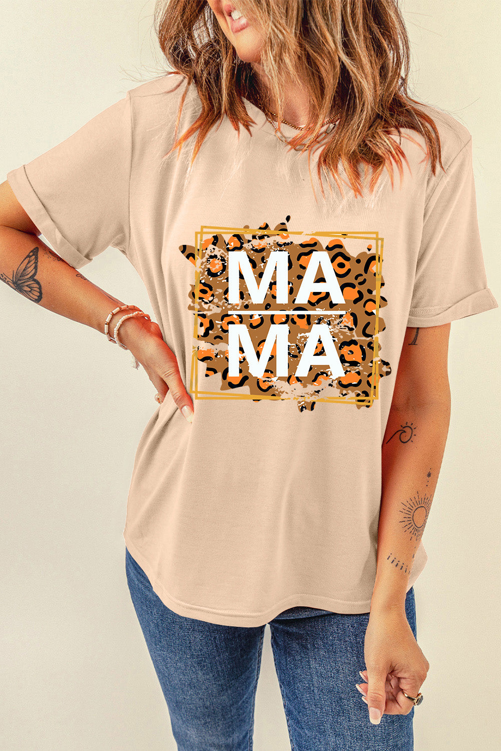 Tan cotton graphic tee with leopard print "Mama" text, short sleeves, and a crew neck.
