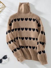 Taupe acrylic turtleneck sweater with black heart intarsia pattern.
