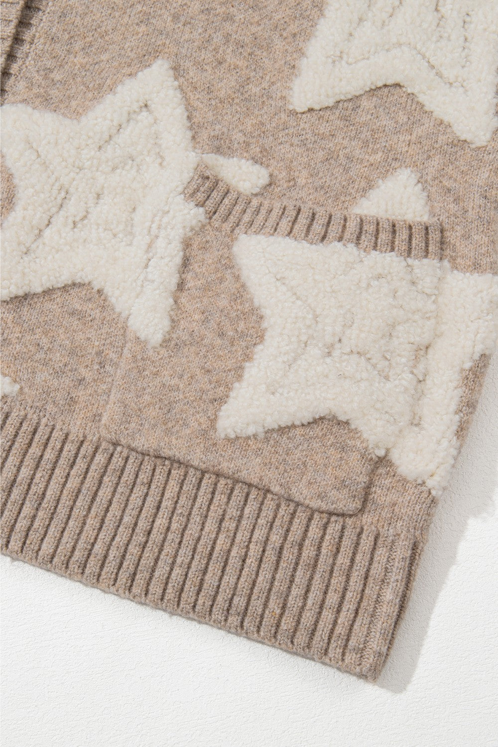 Textured starburst knit cardigan in mocha with white sherpa stars and ribbed trim.