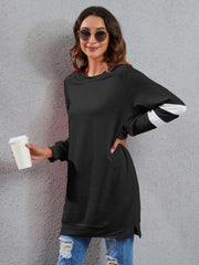 Black sweatshirt dress with varsity stripes on sleeves, crew neck, and side slits.