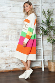 Beige midi sweater dress with rainbow stripes and "PEACE" lettering.