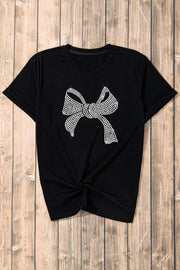 Black t-shirt with rhinestone bow graphic and knotted hem.