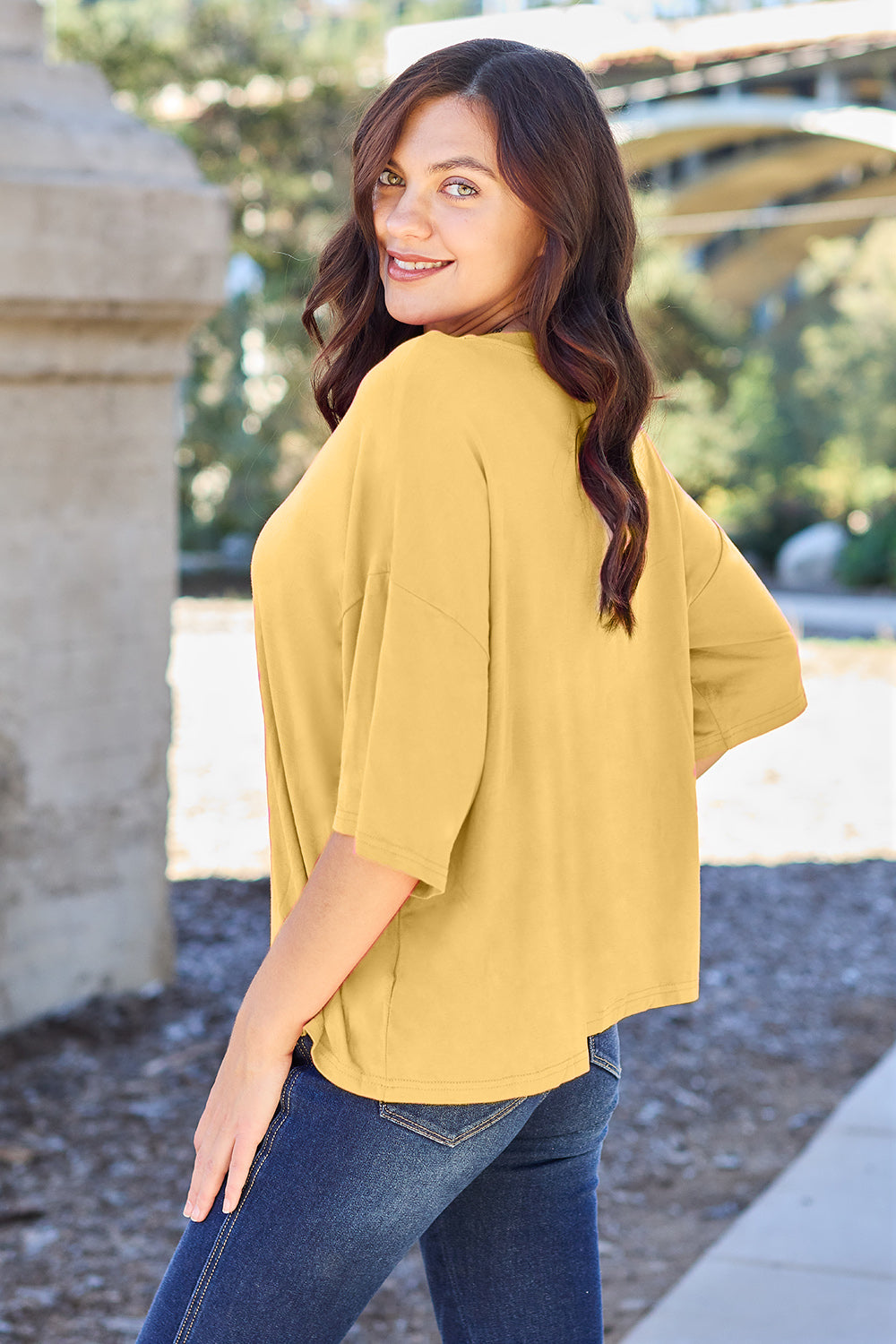 Yellow boxy dolman crop t-shirt with short sleeves and a relaxed fit.