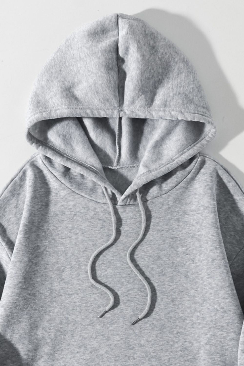 Gray oversized hoodie with drawstring and pouch pocket detail