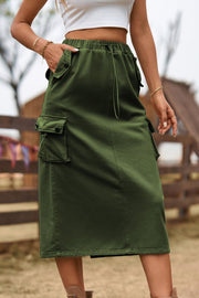 Army green midi skirt with drawstring waist and utility pockets.