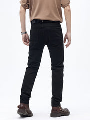 Black cotton slim fit moto jeans with ribbed panels and buttoned closure.