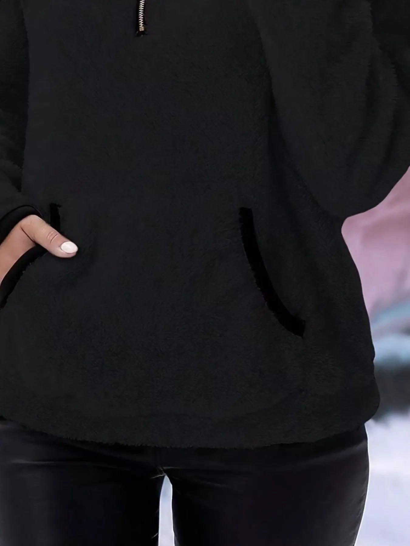 Black fleece quarter zip pullover with front pocket detail