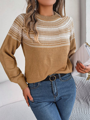 Tan knit sweater with geometric yoke pattern and crew neck.