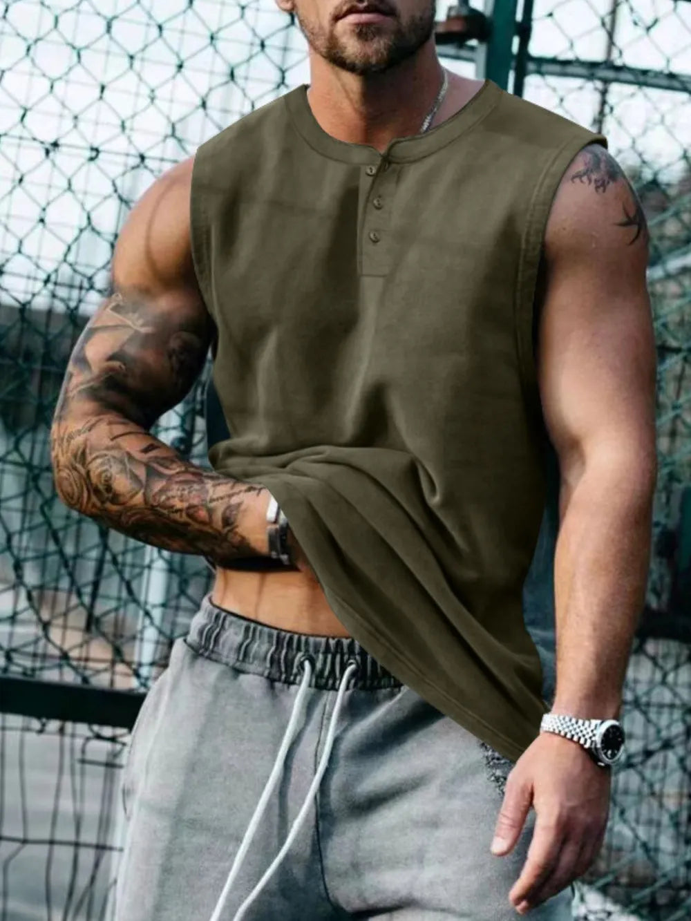 Army green henley neck sleeveless muscle tank top with button detail.