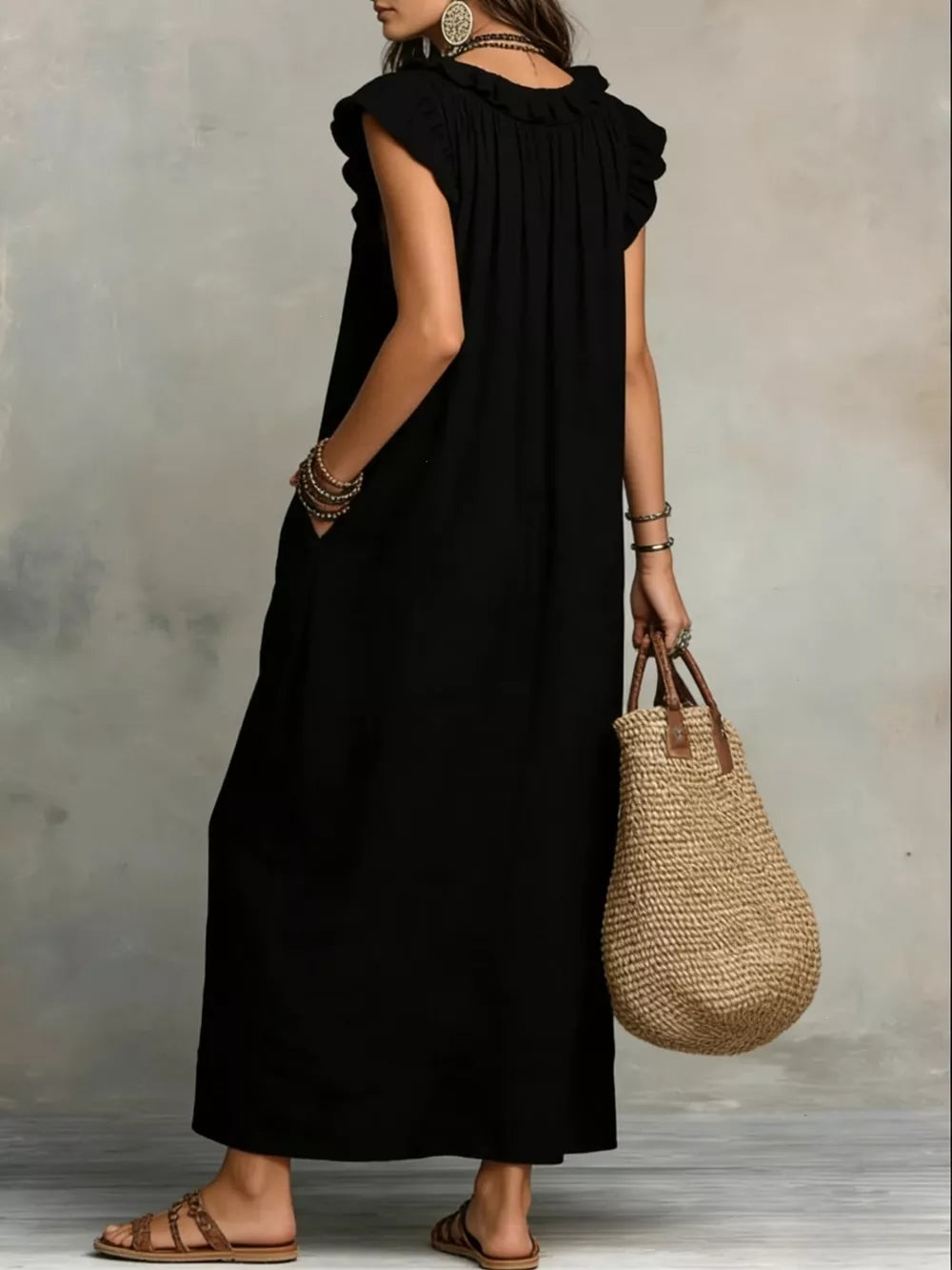 Black ruffled V-neck maxi dress with pockets and short sleeves.