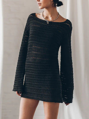 Black crochet mini dress with bell sleeves and a boat neck.