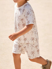 Boys' beige cotton t-shirt and shorts set with tropical palm print.