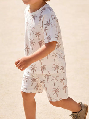 Boys' beige cotton t-shirt and shorts set with tropical palm print.
