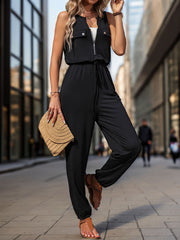 Black utility zip-front jumpsuit with drawstring waist and cuffed ankles.