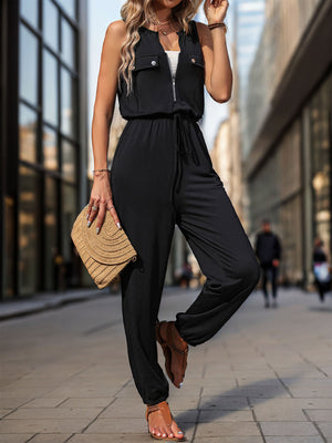Black utility zip-front jumpsuit with drawstring waist and cuffed ankles.