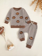 Baby striped football set with long sleeves and drawstring pants.