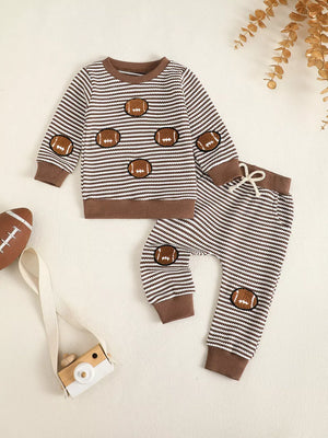 Baby striped football set with long sleeves and drawstring pants.