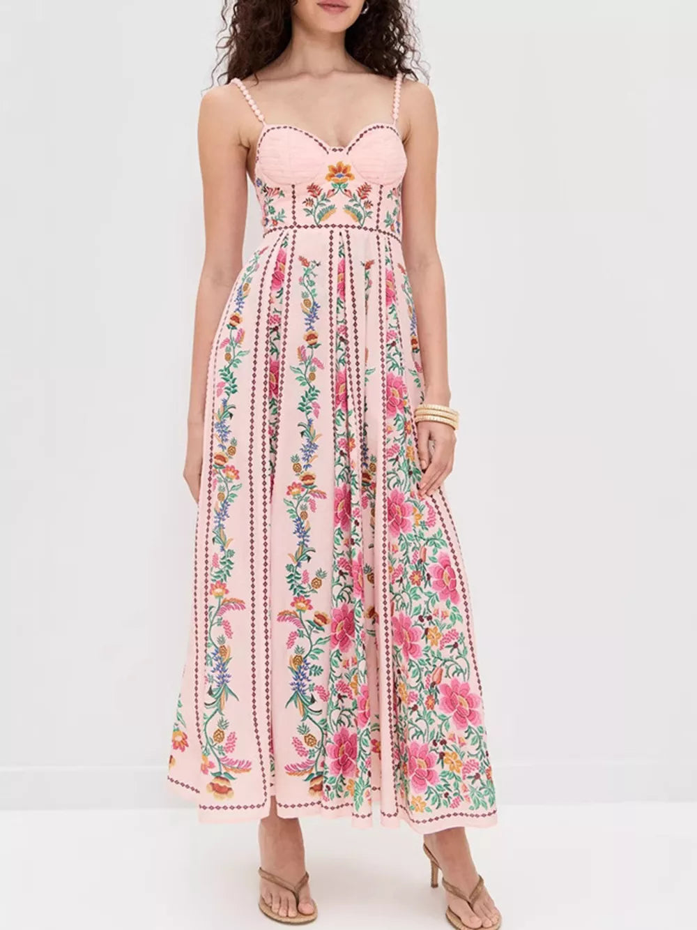 Charming floral sweetheart neckline dress with a pink base and vibrant botanical print.