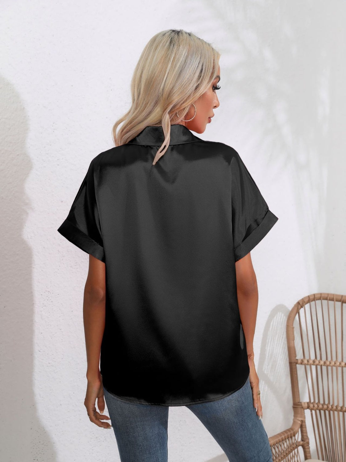 Black satin boxy sleeve blouse with cuffed short sleeves and a collared neckline.