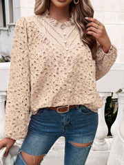 Tan eyelet embroidered blouse with ruffle collar and button front.