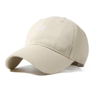 Beige baseball cap with curved brim and white embroidered logo detail.