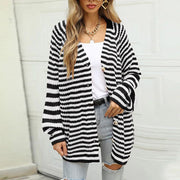 Black and white stripe button-up knit cardigan with bell sleeves.
