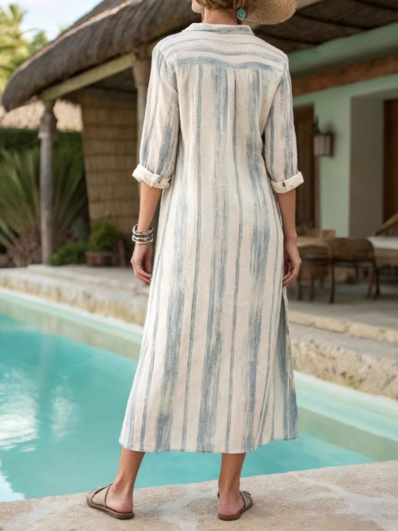 Button-down midi dress in beige with blue vertical stripes, collared, 3/4 sleeves.