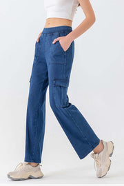 Utility denim cargo pants in dark wash blue with multiple pockets and a relaxed fit.