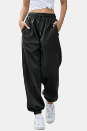 Black relaxed-fit cuffed sweatpants with drawstring waist and pockets.