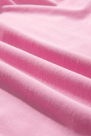 Pink cotton co-ord set with ruffled neckline detail