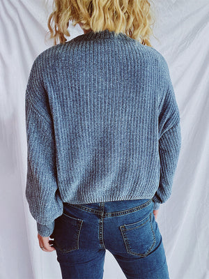 Light blue ribbed knit crewneck pullover sweater with relaxed fit