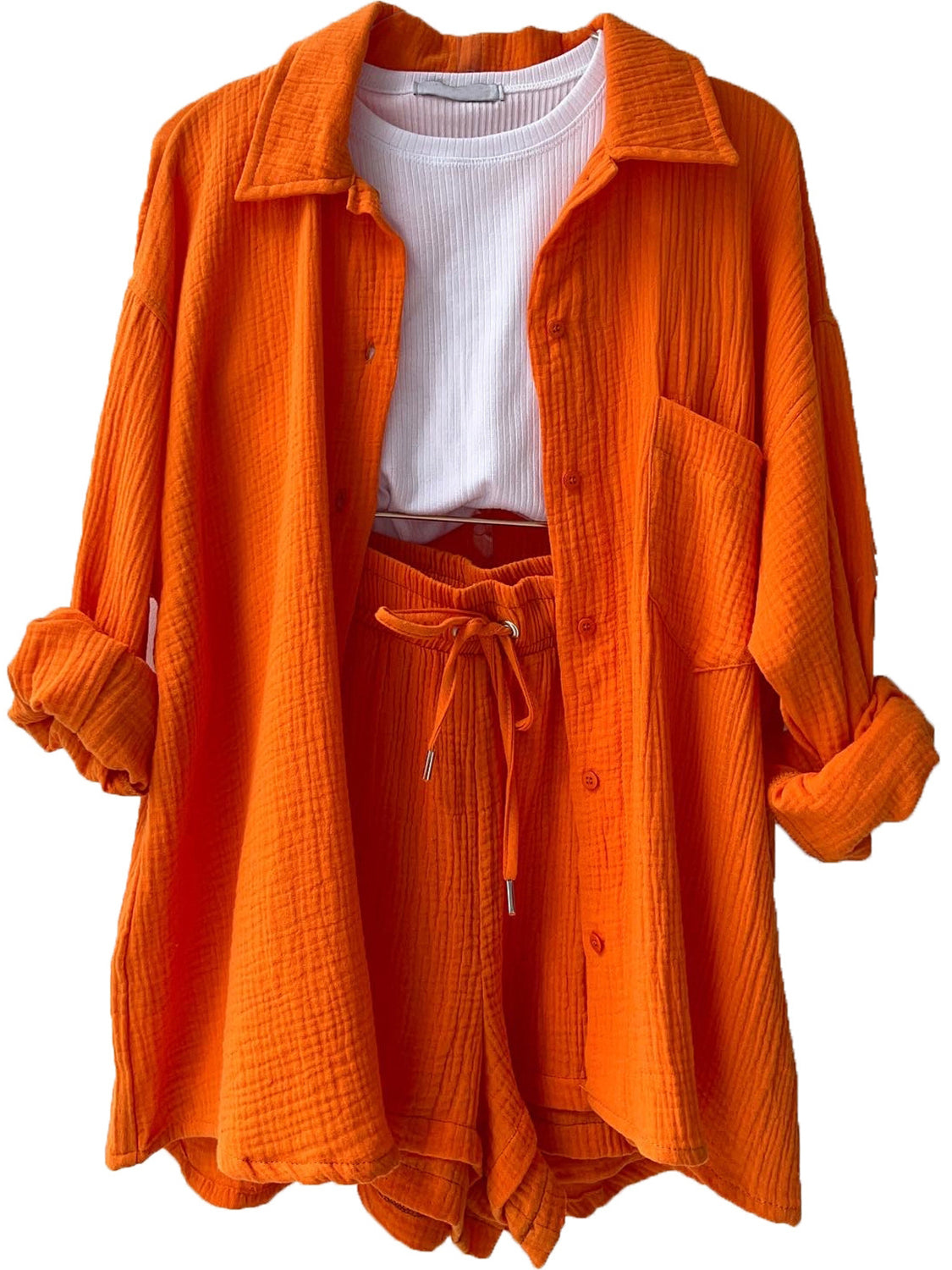 Orange textured gauze shirt and shorts set with white ribbed tank top.