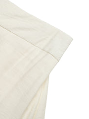 Beige tiered midi skirt with wavy trim detail and textured fabric.