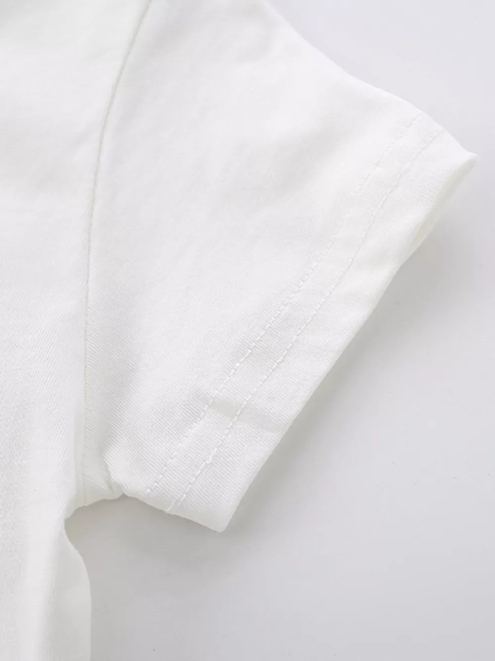 White cotton baby t-shirt sleeve detail with double stitching