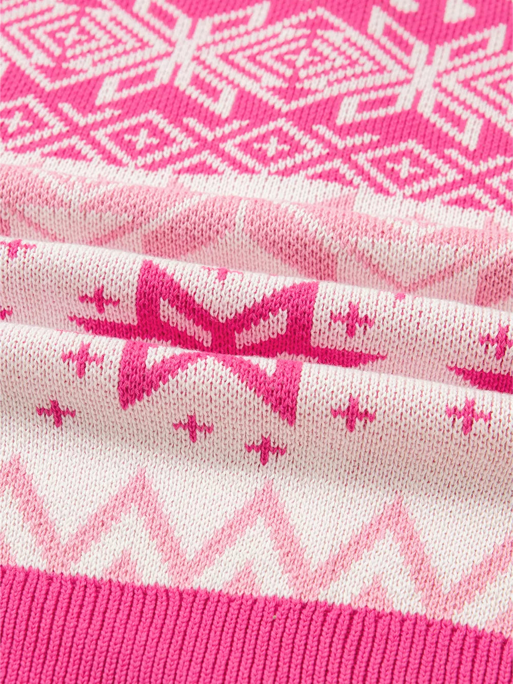 Pink and white fair isle knit sweater with a quarter zip detail.