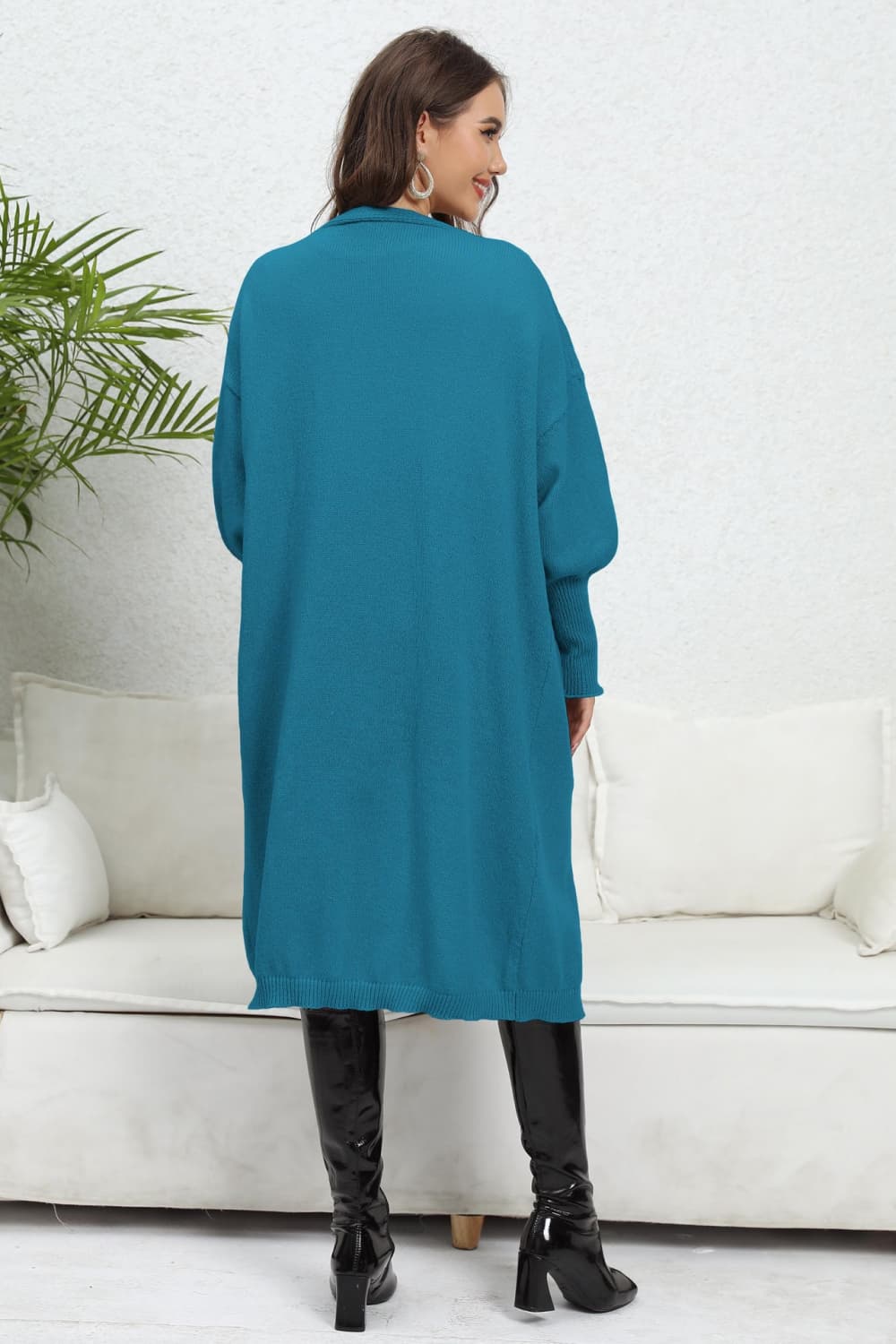 Cerulean long cardigan with balloon sleeves and a collared neckline.