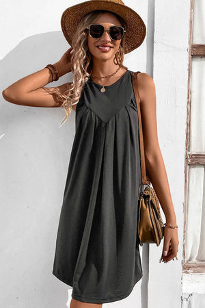 Dark gray sleeveless trapeze dress with pleated yoke detail