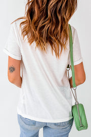 White t-shirt with rolled sleeves and an eye tattoo on the arm.